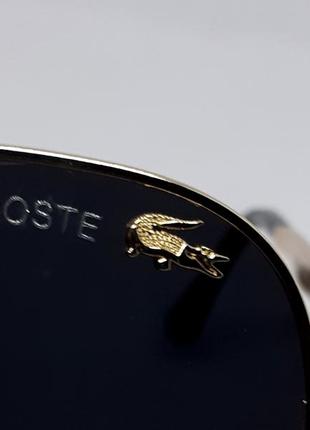 Lacoste чоловічі сонцезахисні  каплі чорні в золотому метвлі поляризовані на флексах9 фото