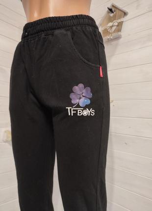 Теплые спортивные штаны на манжетах с кармашками на 9-14  лет2 фото