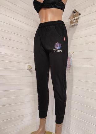 Теплые спортивные штаны на манжетах с кармашками на 9-14  лет5 фото