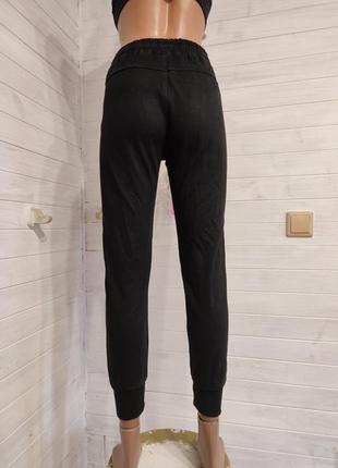 Теплые спортивные штаны на манжетах с кармашками на 9-14  лет6 фото