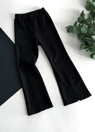Кльошні брюки з розрізами для дівчинки