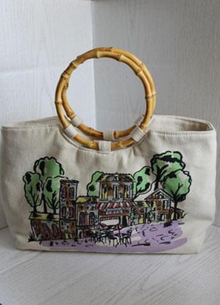 Текстильная светлая сумка с рисунком и деревянными круглыми ручками1 фото
