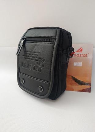 Чоловіча сумка на пояс leastat в комплекті з довгим плечовим ременем.