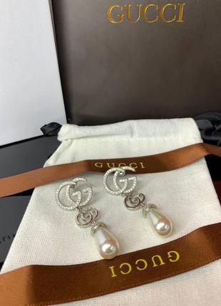 Срібні брендові сережки з цирконами та перлами майоражу, є логотип, люкс якість!2 фото