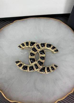 Брендова брошка чорно золота