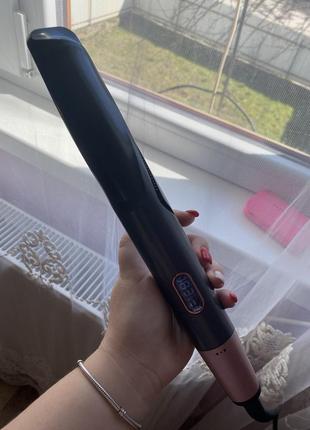 Плойка, яка крутить локони, і випрямляє волосся