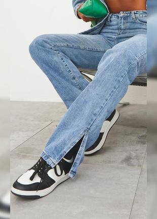 Трендові цупкі джинси з розрізами знизу1 фото