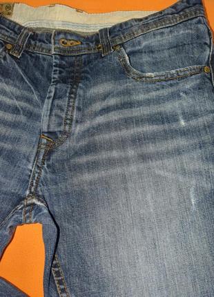 Стильные джинсы от известного бренда.9 фото