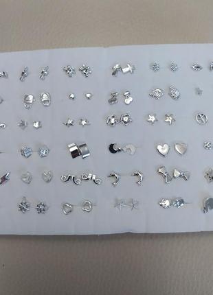 Сережки-цвяшки набір із 36 пар у срібному кольорі2 фото