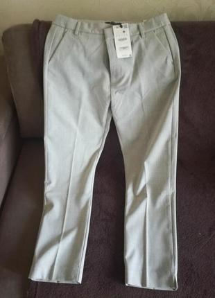 Сірі брюки-дудочки бершка