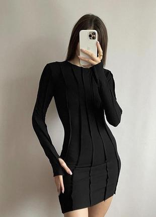 Чорна сукня в рубчик з вивернутими швами1 фото