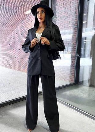 Костюм жіночий класичний чорний однотонний оверсайз піджак на гудзиках штани вільного крою на високій посадці на блискавці2 фото