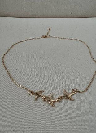 Подвеска золотого цвета с птичками