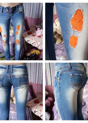 Рваные джинсы с имитацией потертости