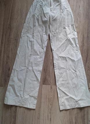 Легкие белые брюки брючины клеш1 фото
