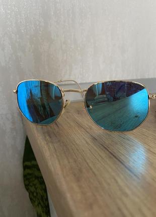Сині круглі дзеркальні сонцезахистні окуляри із золотистою оправою2 фото