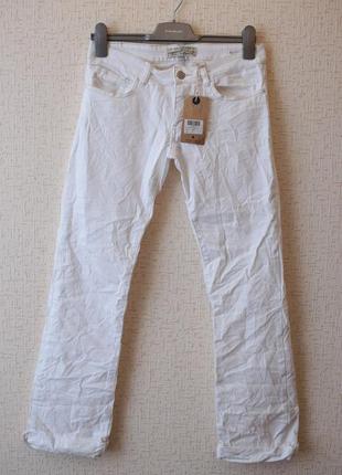 Білі м'які джинси з легким буткатом