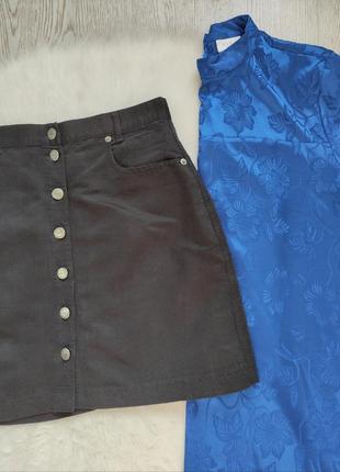 Черная короткая юбка трапеция с кнопками пуговицами спереди карманами вискоза5 фото