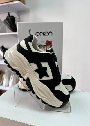 Жіночі класні шкіряні кросівки демісезон натуральна шкіра весна осінь чорно білі