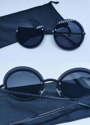 Окуляри сонцезахисні жіночі без оправи круглі чорні1 фото