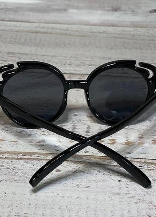 Детские очки солнцезащитные черные с синими вставками бабочка5 фото