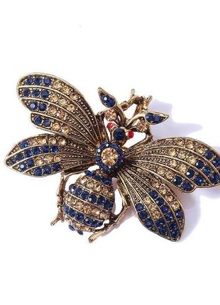 Брошка-бавовка метелик із золотисто-синіми каменями золотиста