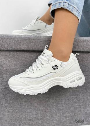 Білі шкіряні кросівки з сіткою в сітку на товстій грубій підошві платформі