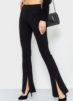 Стильные качественные черные женские штаны в рубчик демисезонные женские штаны с разрезами трикотажные женские штаны трубы штаны клеш штаны-клеш3 фото