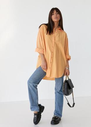 Довга жіноча помаранчева сорочка з напівкруглим низом5 фото