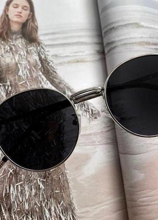 Жіночі сонцезахисні окуляри. чорні в срібній оправі