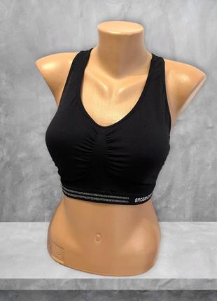 Безшовний спортивний топ із v-подібним вирізом ergeenomixx із паролоновими вставками.