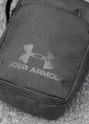 Маленькая городская сумка мессенджер under armour solo черная из ткани через плечо молодежная барсетка на 4 от8 фото