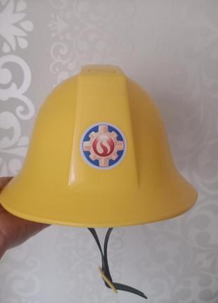 Детский музыкальный шлем пожарника.