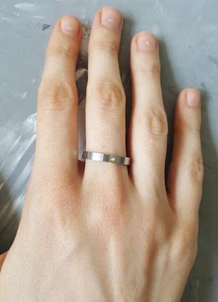 Кольцо серебристого цвета р 18 мм с цирконием стразы тренд 20192 фото