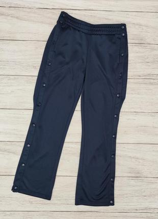 Спортивные штаны с растегивающимися лампасами бренда crane германия