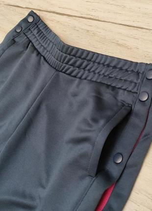 Спортивные штаны с растегивающимися лампасами бренда crane германия