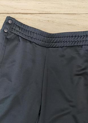 Спортивные штаны с растегивающимися лампасами бренда crane германия