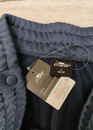 Спортивные штаны с растегивающимися лампасами бренда crane германия