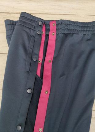 Спортивные штаны с растегивающимися лампасами бренда crane германия