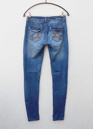 Потертые стрейчевые джинсы2 фото