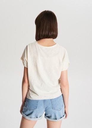 Продам новую женскую летнюю футболку5 фото