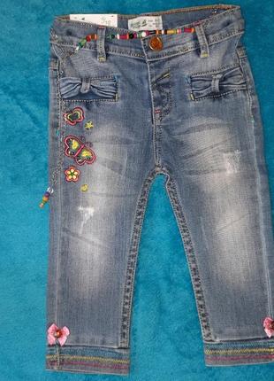 Нові стильні джинси на 9-12 міс1 фото