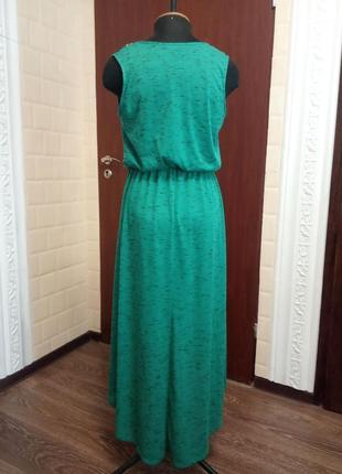 Сукня бірюзового кольору з аплікацією з бісеру.2 фото