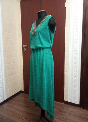 Сукня бірюзового кольору з аплікацією з бісеру.3 фото