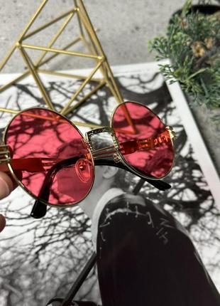 Крупные круглые солнцезащитные очки. красные в золотой оправе.2 фото