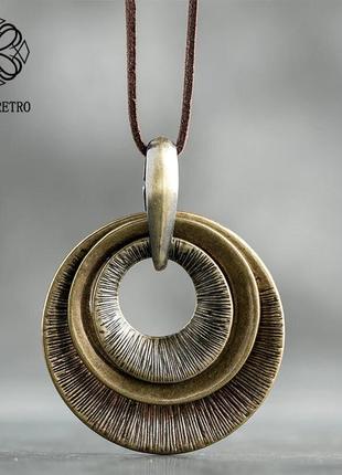 Етнічний кулон зі шкіри і металу "кола". підвіска в стилі бохо