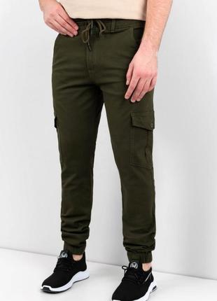 Чоловічі штани кольору хакі з кишенями карго1 фото