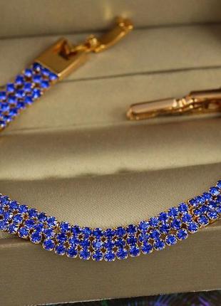 Браслет xuping jewelry три дорожки из синих камней 18.5 см 8 мм золотистый1 фото