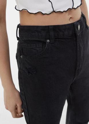 Чорні джинси кльош з необробленим краєм5 фото