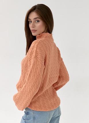 Жіночий подовжений светр у косичку з блискавкою на горловині.10 фото